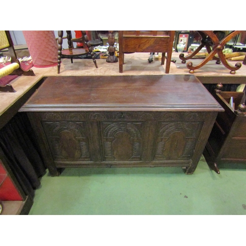 4185 - A 17th Century oak coffer with carved panels to front on stile feet, old woodworm, 74cm tall x 132cm... 