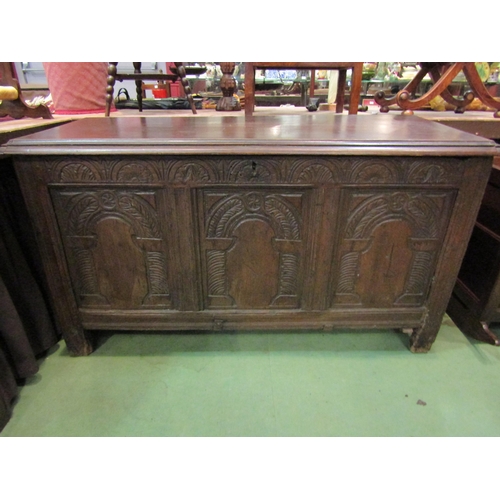 4185 - A 17th Century oak coffer with carved panels to front on stile feet, old woodworm, 74cm tall x 132cm... 