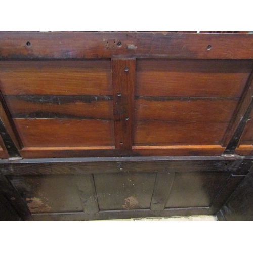 4185 - A 17th Century oak coffer with carved panels to front on stile feet, old woodworm, 74cm tall x 132cm... 