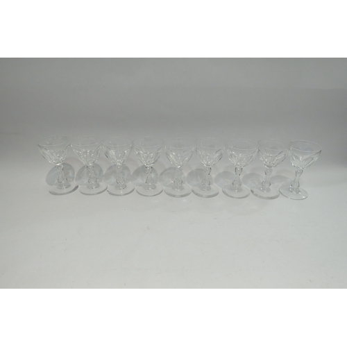 4417 - Nine blade cut liquer glasses raised on baluster stems