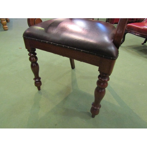 4002 - A Victorian style walnut desk armchair with scroll arms over turned and tapering fore legs