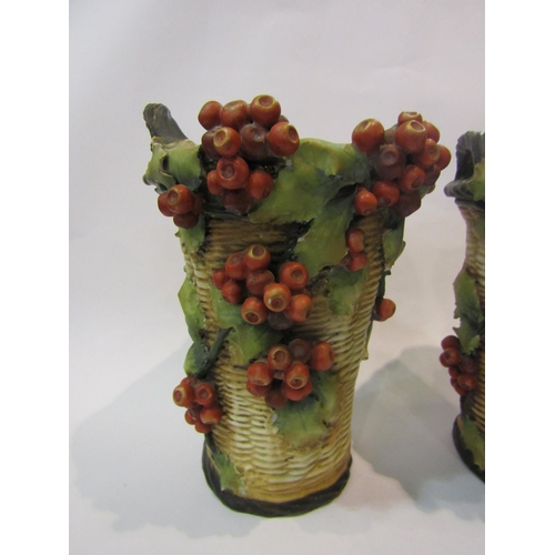 4006 - A pair of majolica style vases, basket weave form with applied ivy leaf and berries, possibly French... 
