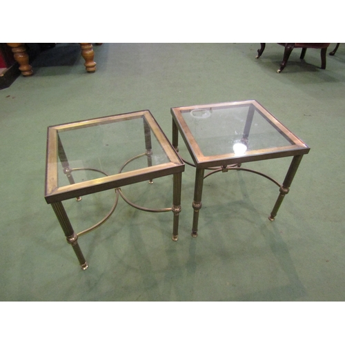 4007 - A pair of glass topped brass lamp tables with fluted supports on 'X' stretchers, 36cm tall x 36cm wi... 