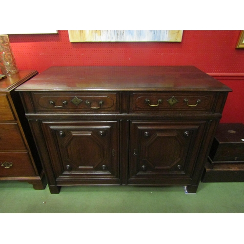 4030 - A 19th Century French pegged oak dresser base, the two drawers over a two door cupboard on stile fee... 