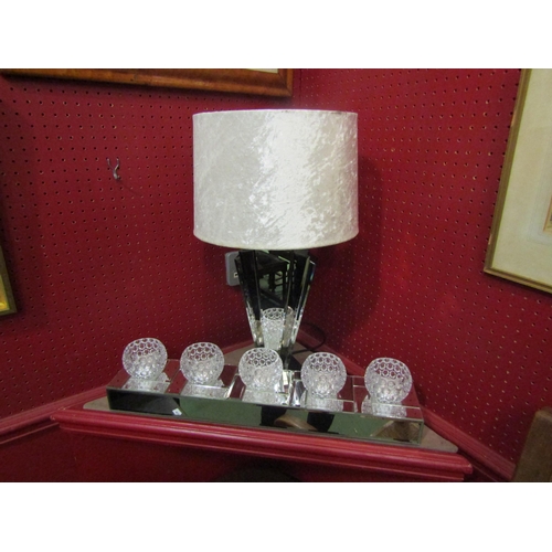 4037 - A Julien Macdonald bevelled glass votive holder together with a Maison Art Deco style mirrored table... 