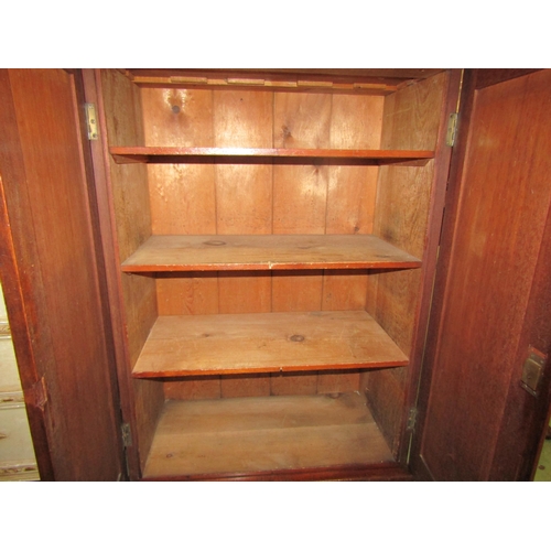 4057 - A mid Victorian mahogany two door linen cupboard with working lock and key, 108cm tall x 82cm wide