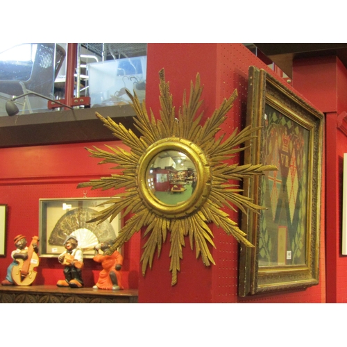 4058 - A gilt framed sunburst form convex mirror, mirror plate 11.5cm diameter