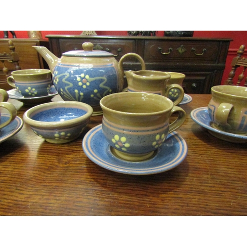 4061 - An Aysgarth Pottery, N. Yorks Studio pottery tea set, beige ground, blue panels, slip flower teapot,... 