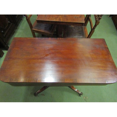 4065 - A Regency crossbanded flame mahogany D-shape fold-over top card table on a slab column and canted co... 