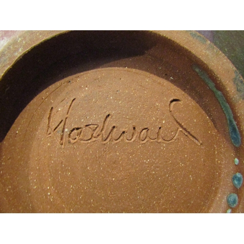 4080 - A Studio Pottery shallow form charger, indistinctly signed to base, 29cm diameter               (E) ... 