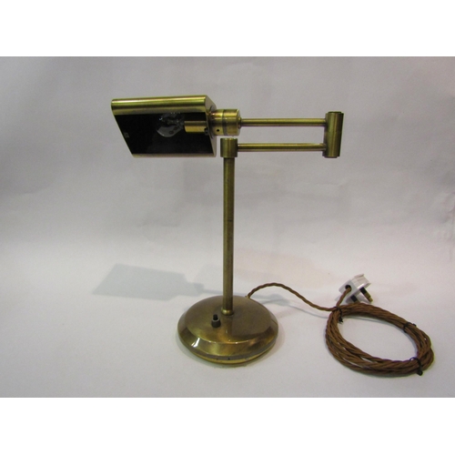 4096 - A brass swing arm desk lamp