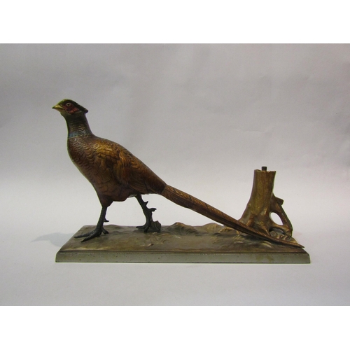 4097 - A novelty cast metal table lighter in the form of a pheasant, painted detail, the lighter concealed ... 