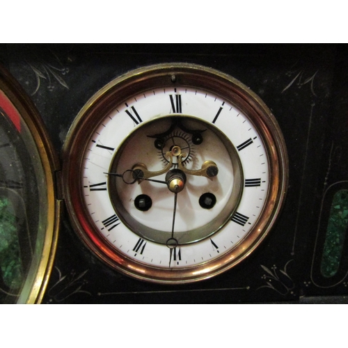 4105 - A black slate mantel clock of architectural form with pendulum, 22cm tall x 36cm wide x 16cm deep