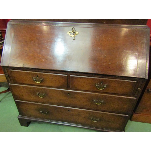 4123 - A circa 1800 George III country oak bookcase bureau, the two door cupboard with key over a fitted in... 