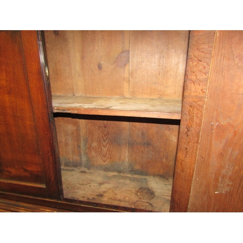 4123 - A circa 1800 George III country oak bookcase bureau, the two door cupboard with key over a fitted in... 