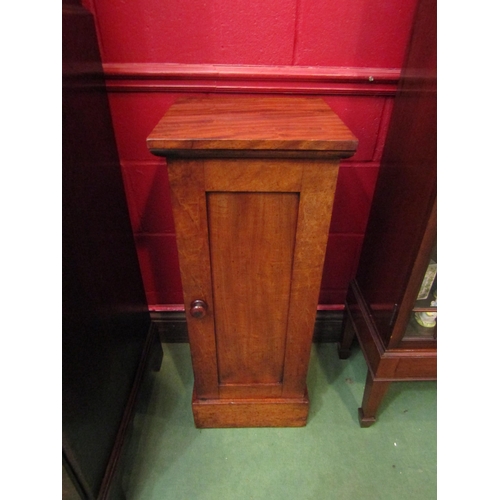 4126 - A circa 1840 country house flame mahogany single door cabinet with turned handle over a deep plinth ... 