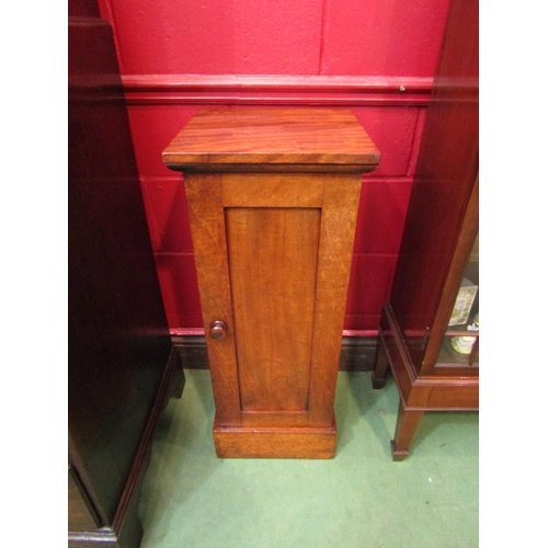 4126 - A circa 1840 country house flame mahogany single door cabinet with turned handle over a deep plinth ... 