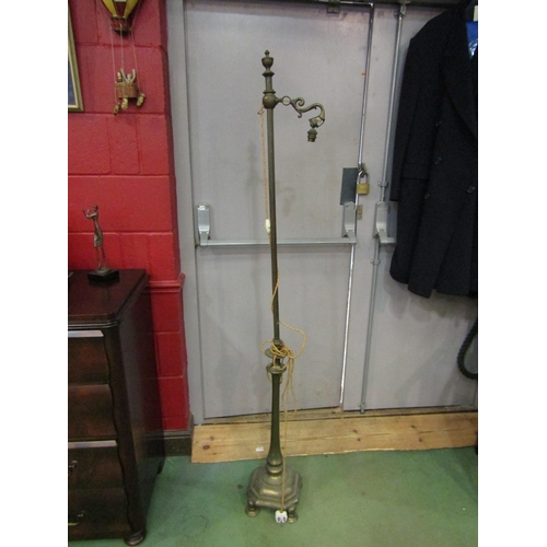 4140 - A late Victorian/early 20th Century brass standard lamp on octagonal plinth form base