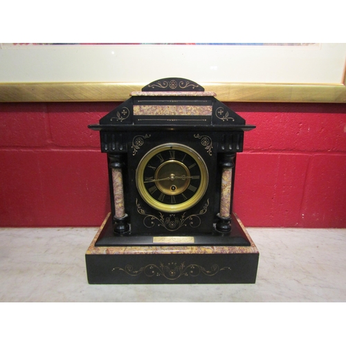 4143 - A slate mantel clock of architectural form, Roman numerated dial, with two pendulums and key, 38cm t... 