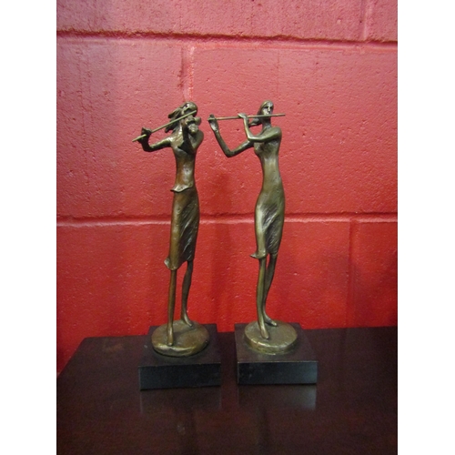 4152 - Two bronze effect figures of ladies playing instruments on plinth bases, 28cm tall