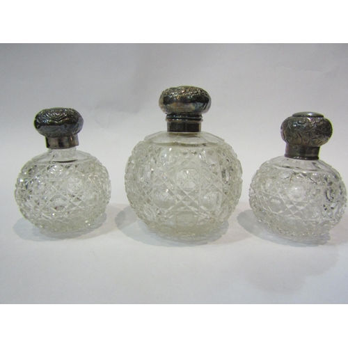 4300 - Three silver topped dressing table bottles