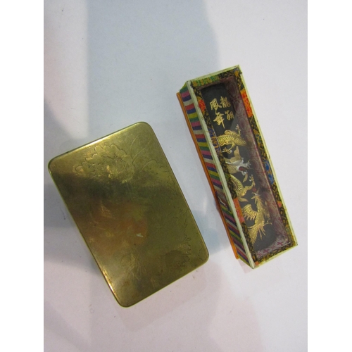 4347 - A vintage Chinese brass scribe's ink box and an ink stick