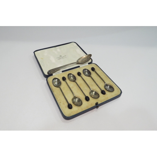 4354 - A cased set of six silver coffee bean spoons and a silver teaspoon