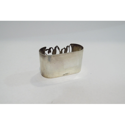 4357 - A silver napkin ring with pierced floral decoration, Sheffield 1983