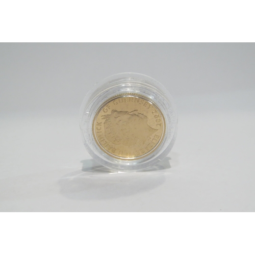 4358 - A 2002 Guernsey £25 gold coin with Royal Mint certificates, set in Westminster mint box