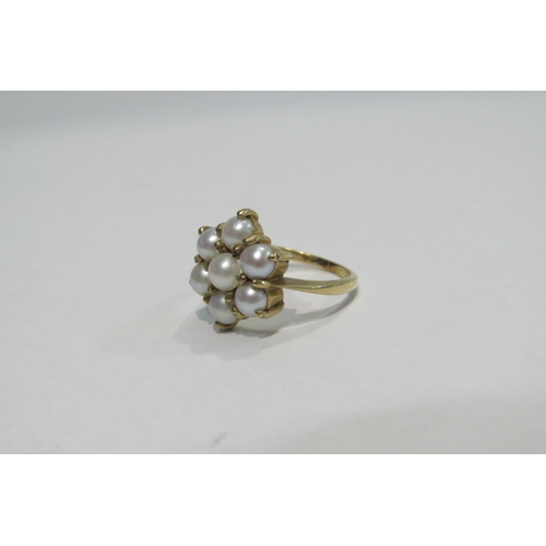 4374 - A 9ct ring wih pearls in floral setting, approximately 3.8g