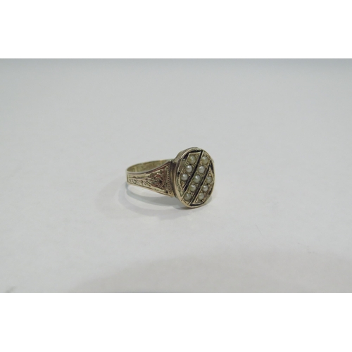 4378 - A 9ct gold ring, the black enamel and seed pearl front with engraved shoulders      (R) £60