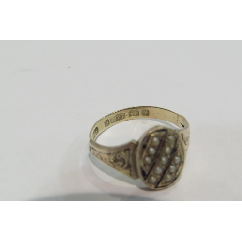 4378 - A 9ct gold ring, the black enamel and seed pearl front with engraved shoulders      (R) £60