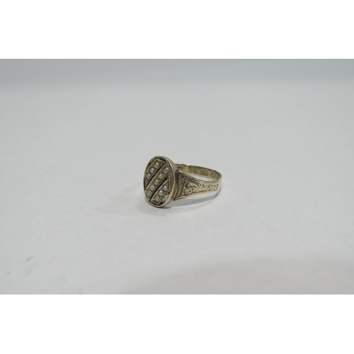 4378 - A 9ct gold ring, the black enamel and seed pearl front with engraved shoulders      (R) £60