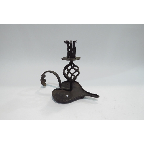 4394 - An 18th Century forged metal candlestick, 18.5cm tall