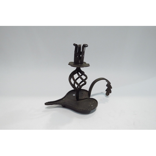 4394 - An 18th Century forged metal candlestick, 18.5cm tall