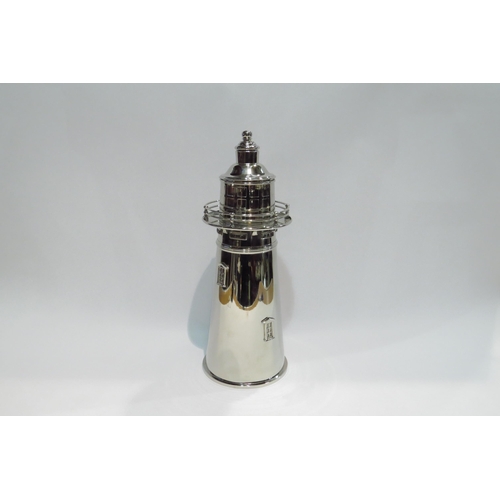 4396 - A silver plated vintage cocktail shaker in the form of  a lighthouse, marks to base, with dust cover... 