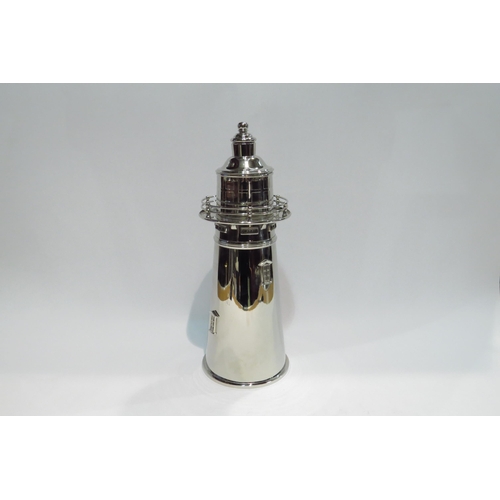 4396 - A silver plated vintage cocktail shaker in the form of  a lighthouse, marks to base, with dust cover... 