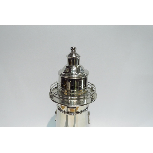 4396 - A silver plated vintage cocktail shaker in the form of  a lighthouse, marks to base, with dust cover... 