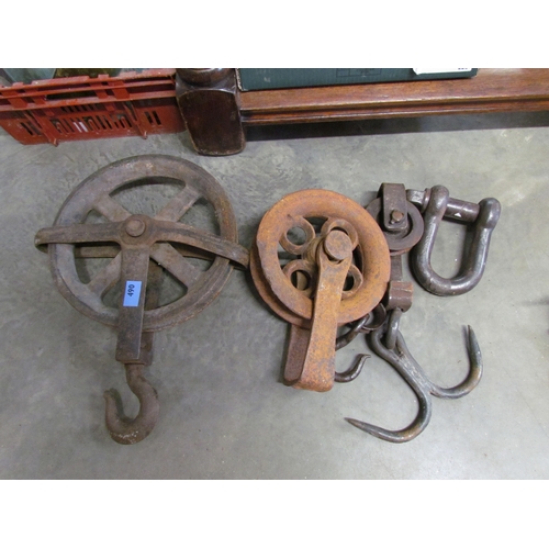 2082 - Three iron pulleys and a hook