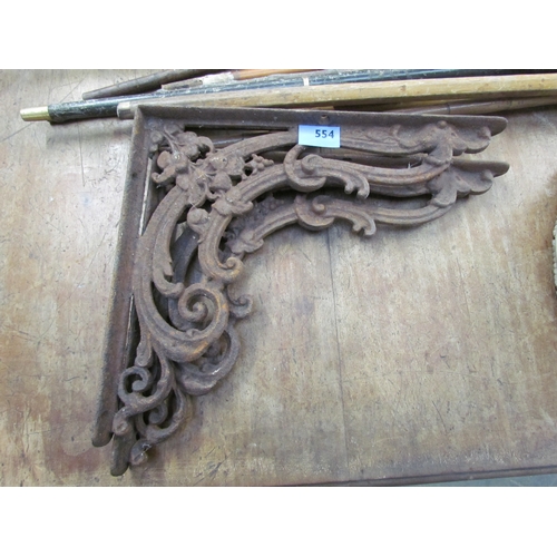 2064 - A pair of cast iron brackets