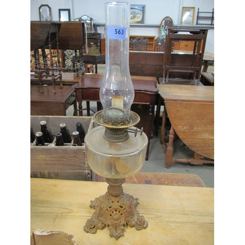 2094 - A Victorian oil lamp, clear glass sump, wrought iron base