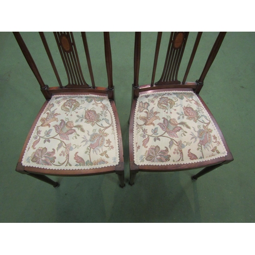 4162 - A pair of Edwardian Arts & Crafts inlaid mahogany chairs with finial decoration over a pierced and i... 