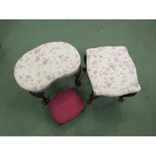 4168 - A pair of matching upholstery stools with cabriole legs and a red footstool (3)