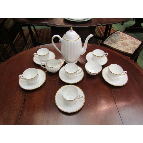 4169 - A Susie Cooper coffee set, white ribbed ground, gilt embellishment