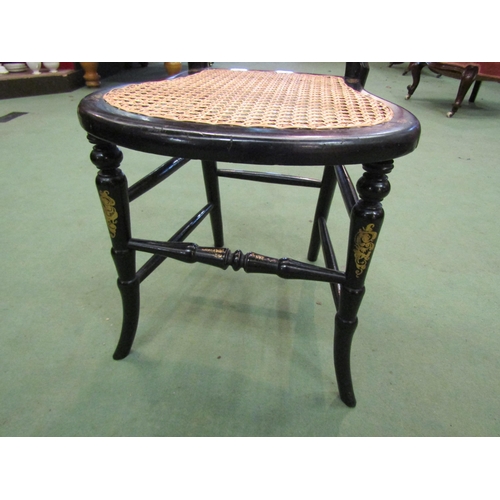 4195 - A Victorian black lacquered and mother-of-pearl inlaid chair, the kidney shape backrest over a cane ... 