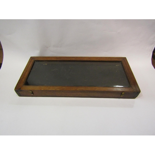 4196 - A rectangular oak table-top display case, slide action top, 6cm tall x 55cm long x 24cm wide