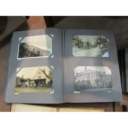 4198 - A quantity of postcard and photograph albums including topographical, equestrian and livestock theme... 