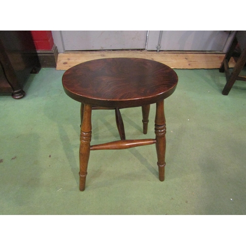 4207 - An elm seat and ash stool, the oval seat over ring turned legs joined by an 