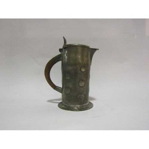 4231 - An Art Nouveau Liberty pewter (Archibald Knox) lidded jug, 15.5cm tall  (R)  £40