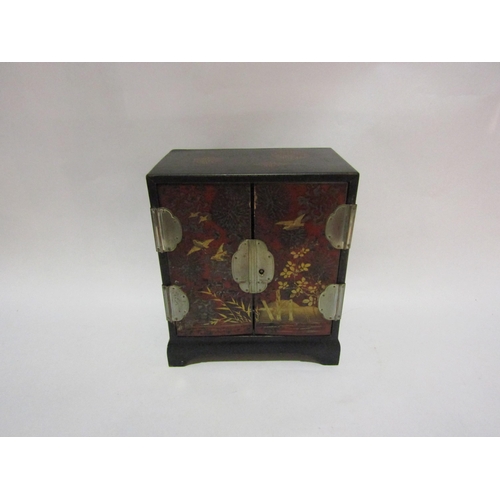 4279 - A table top lacquered jewellery chest twin doors over painted with  birds in landscape (no key)